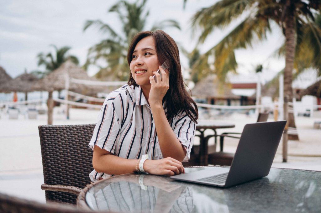 Asian woman enjoying Blesiure Travel
