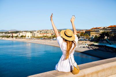 happy-elegant-woman-posing-back-put-her-hand-air-enjoying-amazing-view_11zon-scaled.jpg