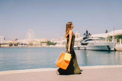 woman-walking-with-shopping-bags-seaside_11zon-1-scaled.jpg
